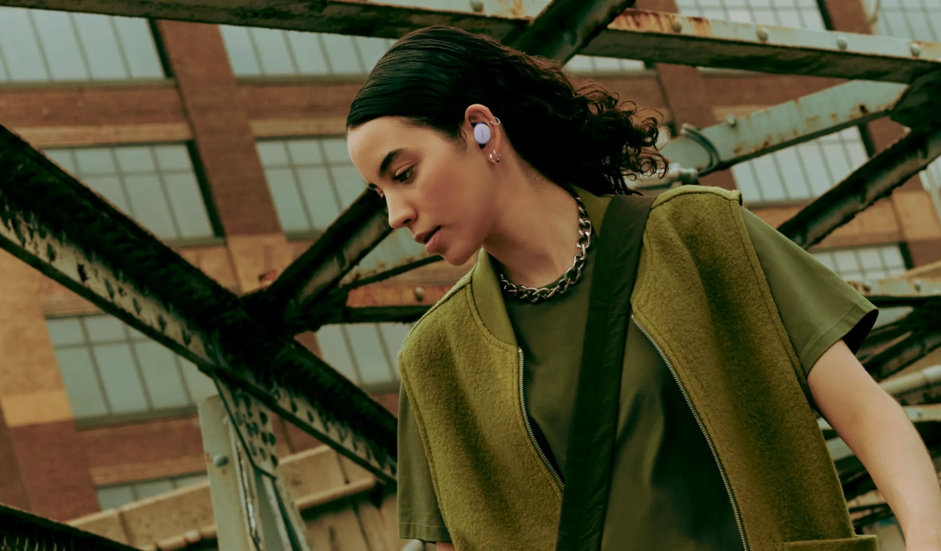 Woman wearing Bose QuietComfort Earbuds outside